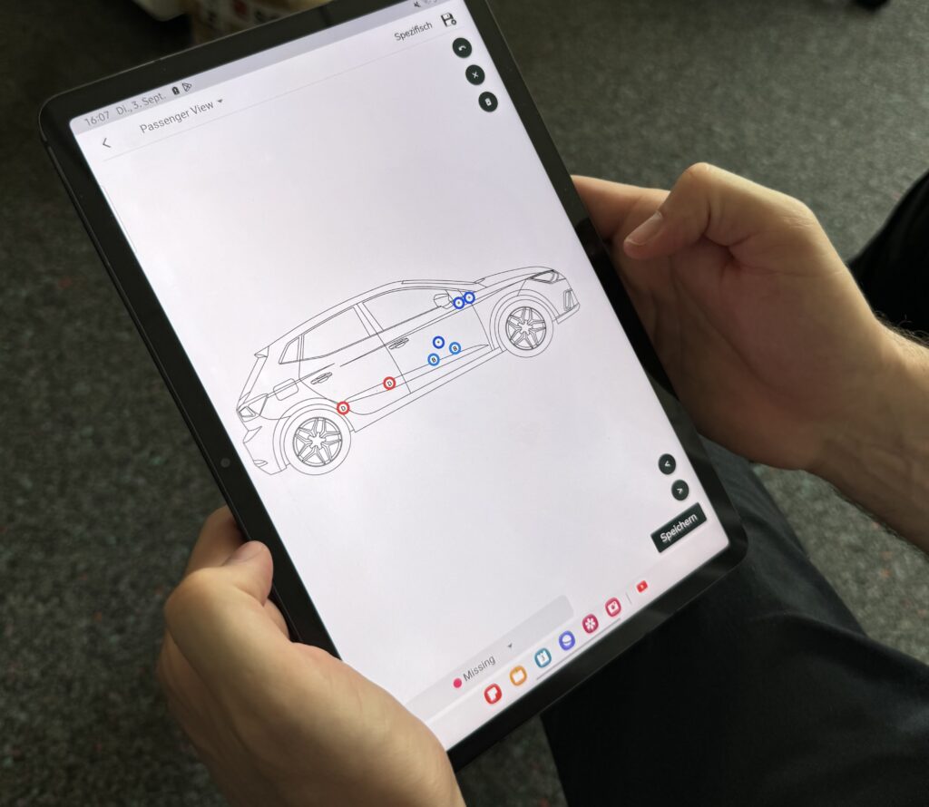 Technician inspecting a vehicle